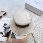 Soft canvas bucket hat with embossed leather logo patch and adjustable chin strap