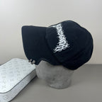 Black cotton cap with flame embroidery and notched brim