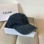 Washed blue denim cap with tonal emblem and gold buckle