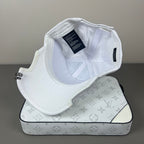 White cotton cap with black graphic embroidery and sculpted brim