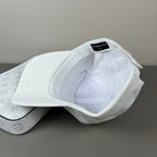 White cotton cap with graphic emblem and contrast brim embroidery