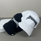 Black cotton cap with flame embroidery and notched brim