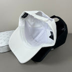 Black cotton cap with white oval emblem embroidery